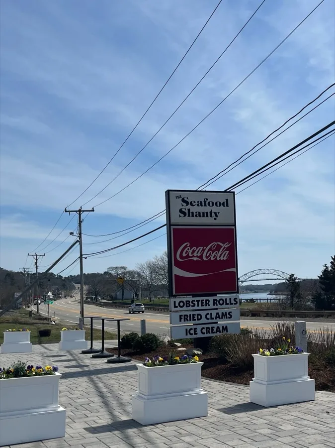 The Seafood Shanty roadside sign overlooking the Cape Cod Canal Railroad Bridge